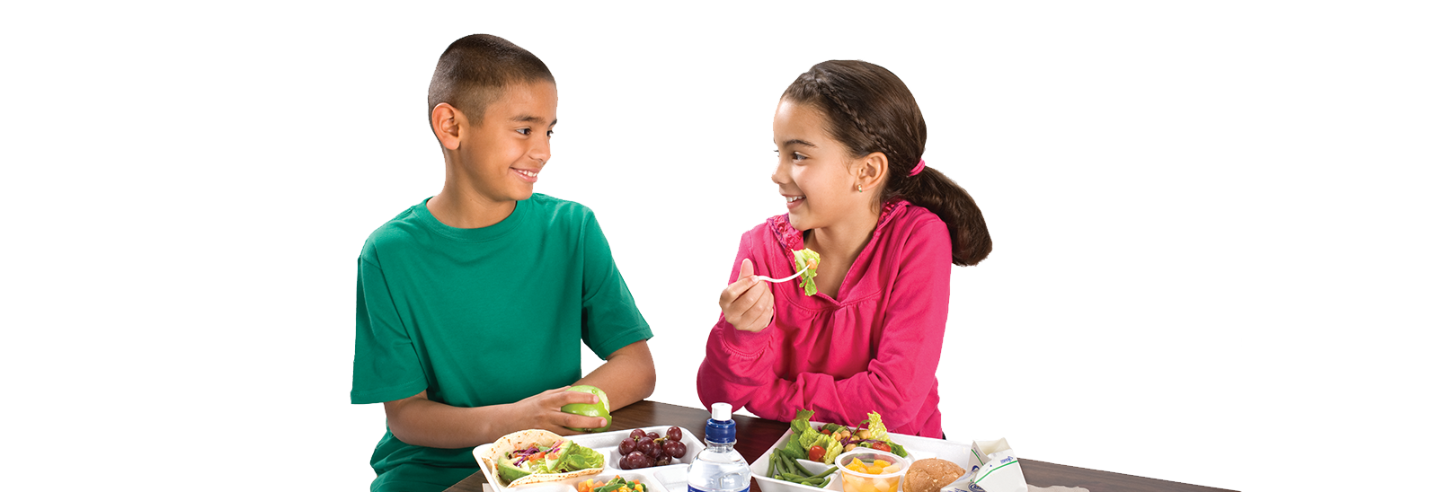 Photo of two children eating healthy meals. 