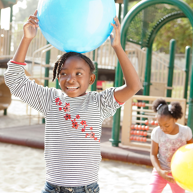 Photo of Champion children playing on playground.