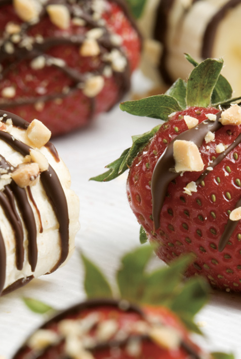 Strawberries drizzled in chocolate and coated with nuts.