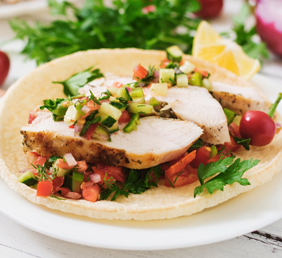 A colorful plate of nutritious dishes, including fresh vegetables, lean proteins, and whole grains.