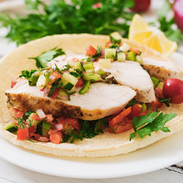 A colorful plate of nutritious dishes, including fresh vegetables, lean proteins, and whole grains.