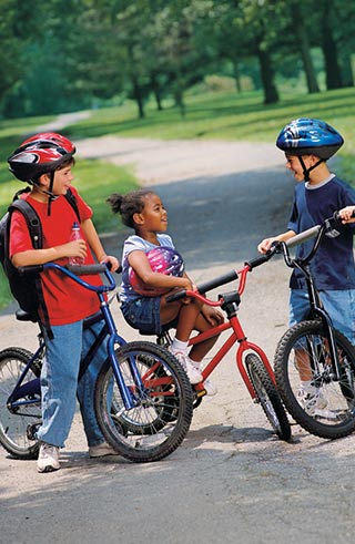 A picture of children gathered on their bicycles